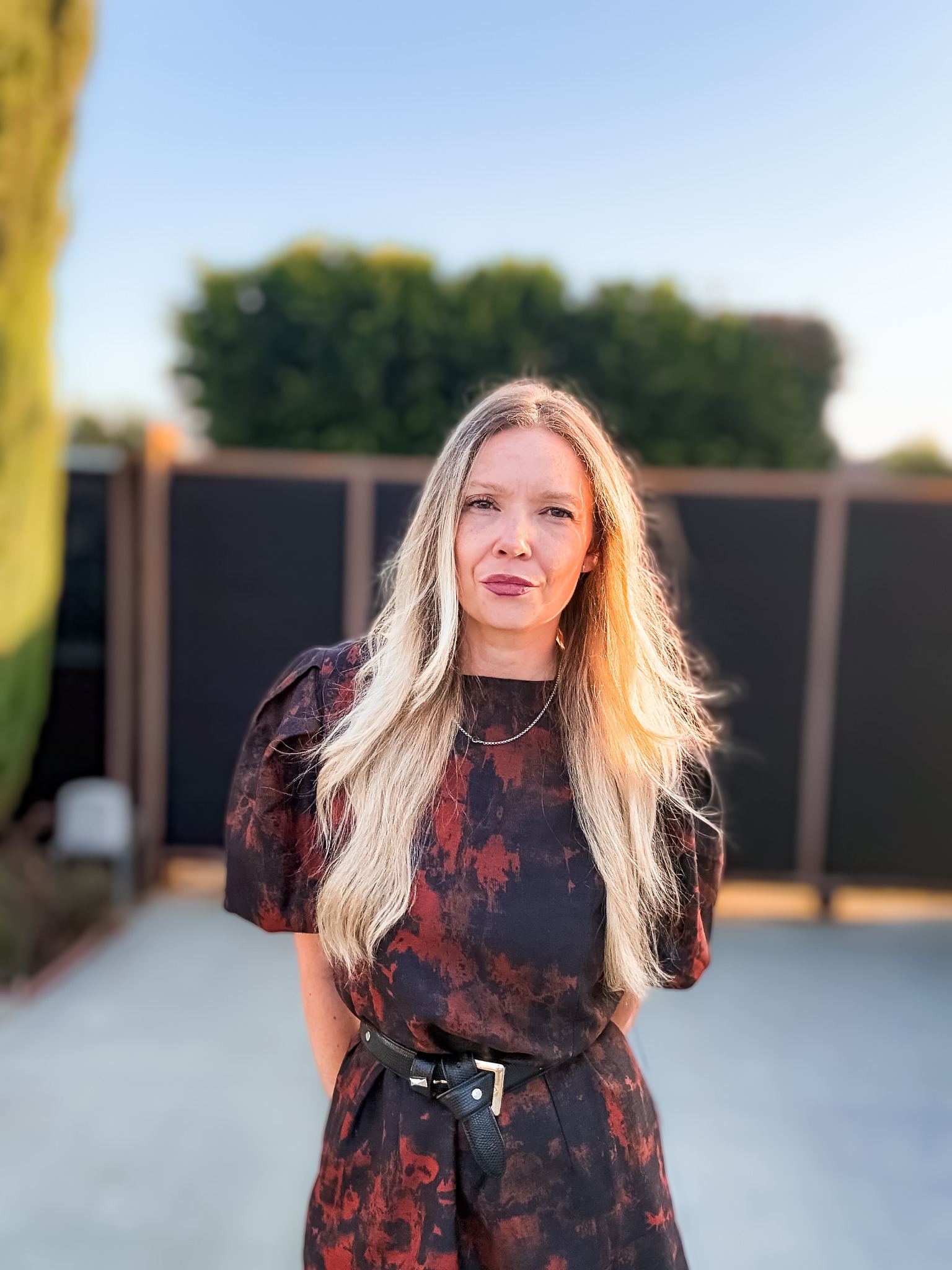 Dayna Brown in a patterned dress